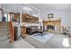 Cozy living room featuring a fireplace and an adjacent dining area at 18771 Mexico E Dr, Aurora, CO 80017