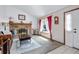 Bright living room featuring a brick fireplace and large window at 18771 Mexico E Dr, Aurora, CO 80017
