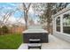 Backyard patio featuring a luxurious hot tub with steps for easy access at 8827 Cactus Flower Way, Highlands Ranch, CO 80126