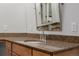 A detailed close up of the bathroom vanity with a mirror and sink at 8827 Cactus Flower Way, Highlands Ranch, CO 80126