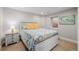 Bedroom with decorative bedding, a window, and a nightstand at 8827 Cactus Flower Way, Highlands Ranch, CO 80126