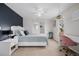 Comfortable bedroom with white nightstand and a desk with a pink chair at 8827 Cactus Flower Way, Highlands Ranch, CO 80126