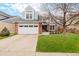 Charming two-story home with a well-manicured lawn, attached two car garage, and inviting curb appeal at 8827 Cactus Flower Way, Highlands Ranch, CO 80126