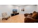 Finished basement living area with comfortable seating and natural light from a window at 8827 Cactus Flower Way, Highlands Ranch, CO 80126