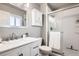 Bathroom with a walk-in shower, white vanity, and marble countertop at 11759 E Asbury Ave, Aurora, CO 80014