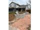 Landscaped front yard with retaining wall and flagstone walkway at 11759 E Asbury Ave, Aurora, CO 80014