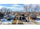 Aerial view of a house with a yard, in a snow-covered neighborhood at 4631 Zuni St, Denver, CO 80211