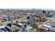 Wide aerial view of a neighborhood with houses and city skyline in the background at 4631 Zuni St, Denver, CO 80211