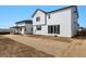 New home backyard with sliding glass doors and patio at 9062 Telluride Ct, Commerce City, CO 80022