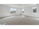 Spacious bedroom featuring neutral carpet and large windows offering plentiful natural light throughout at 9062 Telluride Ct, Commerce City, CO 80022