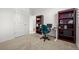 Bright bedroom features a desk and chair for a functional workspace at 3099 Belleville Ridge Rd, Elizabeth, CO 80107