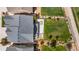 An aerial shot features a well-manicured lawn with a patio and outdoor seating area at 4960 Malaya St, Denver, CO 80249