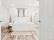 Bright, neutral bathroom featuring a drop-in tub, and modern fixtures at 4960 Malaya St, Denver, CO 80249