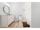 Modern bathroom features vanity, toilet, shower, and neutral tones, creating a soothing and functional space at 4960 Malaya St, Denver, CO 80249