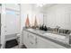 Bathroom with double sink vanity and access to tub/shower combo at 4960 Malaya St, Denver, CO 80249