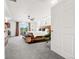 Bright main bedroom boasts a spacious layout, large windows, and private balcony access at 4960 Malaya St, Denver, CO 80249
