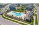 Aerial view of a refreshing community pool with lounge chairs and a picnic area at 4960 Malaya St, Denver, CO 80249