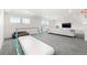 Spacious living room offers plenty of light with space for entertaining and recreation at 4960 Malaya St, Denver, CO 80249