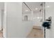Bright, clean tiled shower with glass partition and dual shower heads at 4960 Malaya St, Denver, CO 80249