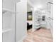 Well-organized walk-in closet provides ample storage with built-in shelves and rods for easy organization at 4960 Malaya St, Denver, CO 80249