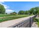 Scenic walking path with views of the golf course and surrounding greenery at 4960 Malaya St, Denver, CO 80249