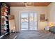 Main bedroom with sliding door to patio and ensuite bathroom at 1488 S Fairfax St, Denver, CO 80222