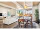 Open concept dining area with mid century modern furniture at 1488 S Fairfax St, Denver, CO 80222