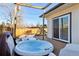 Hot tub on deck with view of backyard at 1488 S Fairfax St, Denver, CO 80222