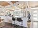 Modern kitchen with white cabinets and a large island at 1488 S Fairfax St, Denver, CO 80222