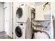 Stackable washer and dryer in laundry closet at 1488 S Fairfax St, Denver, CO 80222