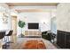 Living room with fireplace and large window at 1488 S Fairfax St, Denver, CO 80222