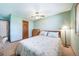 Bright bedroom featuring a comfortable queen-size bed, wooden dresser, and soft, neutral decor at 9745 Derby Way, Parker, CO 80134
