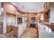 Bright kitchen featuring an island, modern appliances, and ample cabinet space at 9745 Derby Way, Parker, CO 80134