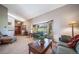 Comfortable living room featuring a large bay window for natural light at 9745 Derby Way, Parker, CO 80134