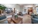 Cozy living room featuring carpet floors, a plant on the coffee table, and staircase at 9745 Derby Way, Parker, CO 80134