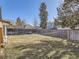 Generous backyard featuring mature trees and a privacy fence at 11002 E Ohio Pl, Aurora, CO 80012