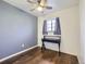 Bedroom showcasing a ceiling fan, hardwood-style flooring, and a cozy atmosphere at 11002 E Ohio Pl, Aurora, CO 80012