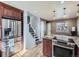 Well lit kitchen featuring stainless steel appliances, granite countertops and hardwood floors at 11002 E Ohio Pl, Aurora, CO 80012