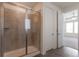 Modern bathroom features a glass shower, tile flooring and white trim at 24314 E Ford Ave, Aurora, CO 80018