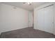 Bedroom boasts plush carpeting, and a convenient closet at 24314 E Ford Ave, Aurora, CO 80018