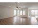 Spacious living area with hardwood floors, recessed lighting, and plenty of natural light from large windows at 24314 E Ford Ave, Aurora, CO 80018