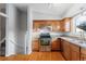 Galley kitchen with stainless steel appliances and wood cabinets at 4122 S Andes Way, Aurora, CO 80013