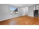 Living room with hardwood floors and window at 4122 S Andes Way, Aurora, CO 80013