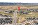Aerial view of a residential neighborhood with mountain views at 8985 Chalk Creek Pl, Littleton, CO 80125