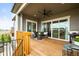 Spacious covered patio with outdoor seating, a grill, and scenic views of the surrounding area at 8985 Chalk Creek Pl, Littleton, CO 80125