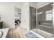 The bathroom features a glass-enclosed shower and an open doorway leading to the main bedroom at 8985 Chalk Creek Pl, Littleton, CO 80125