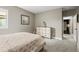 Cozy bedroom featuring plush carpet, natural light, and soothing decor, creating a restful ambiance at 8985 Chalk Creek Pl, Littleton, CO 80125
