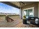 Cozy covered patio with comfortable seating and views of the surrounding neighborhood at 8985 Chalk Creek Pl, Littleton, CO 80125