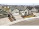 Inviting two-story home featuring a spacious two-car garage, manicured landscaping, and a charming front entrance at 8985 Chalk Creek Pl, Littleton, CO 80125