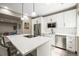 Beautiful kitchen with a large island, stainless steel appliances, and subway tile backsplash at 8985 Chalk Creek Pl, Littleton, CO 80125